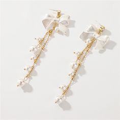 Frame your face with these 18k gold-plated tassel drop earrings embellished with pearl, cubic zirconia and acrylic. 1.3" W x 4.33" L 18k gold-plated copper / cubic zirconia / pearl / acrylic Tassel Drop Earrings, Drop Earring, Accessories Jewelry Earrings, Pearl Necklace, Tassels, Cubic Zirconia, Jewelry Accessories, 18k Gold, Gold Tones