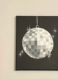 a black and white christmas ornament hanging on a wall