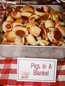 there are pigs in a blanket on top of the table with a red and white checkered tablecloth