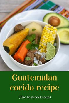 a white bowl filled with food next to an avocado