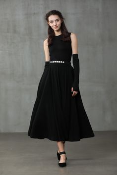 "Winter days do not mean that you need to resign to elegance. Boasting a soft wool-blend construction, this spiral skirt from Linennaive proves that you can be elegant and warm at the same time. Featuring a high waist, a rear zip fastening, a flared style, side pockets and a midi-length. 【Material】 -Wool 87%, Elastane 13% 【Length】 32-33 inches. 【Size】 *SIZE XS length: 32\"/82 cm waist: 26\"/ 66 cm *SIZE S length: 32\"/82 cm waist: 27\"/ 70 cm *SIZE M length: 32\"/82 cm waist: 29/ 75 cm *SIZE L l Winter Party Midi Length Skirt, Elegant Evening Maxi Skirt For Fall, Black A-line Maxi Skirt For Winter, Black Lined Winter Dress, Winter Evening Maxi Skirt With Lining, Black Winter Dress With Lined Skirt, Winter Black Dresses With Lined Skirt, Black Winter Dresses With Lined Skirt, Pleated Maxi Skirt For Evening In Fall