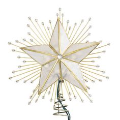 a gold and white star decoration on a stand