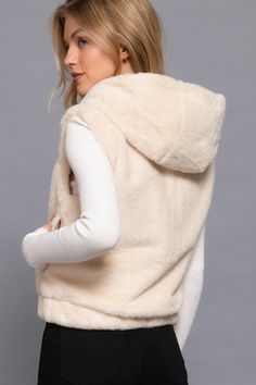 Here's the product description for the Hoodie Faux Fur Vest in Vanilla:Key Features:- Fabric: 100% Polyester; faux fur- Fit: Relaxed, vest style- Color Options: Vanilla- Sizes: S, M, L- Design: Hoodie, faux fur material- Versatile Styling: Ideal for layering over your favorite tops or sweaters, this vest adds a touch of luxury and warmth to any outfit.Product Details:- Comfortable All-Day Wear: Our Hoodie Faux Fur Vest is designed to offer both comfort and style, making it perfect for everyday w Faux Fur Material, Buy Hoodies, Hooded Faux, Valentine Dress, Vest Style, Hoodie Vest, Design Hoodie, Winter Vest, Faux Fur Vest