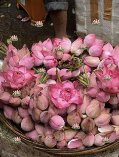 a basket filled with lots of pink flowers