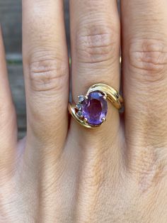 Total Weight: 5.1 grams Size: 6.75 Width: 2.6mm Amethyst: 10x7.8mm Diamonds: 1.5mm Condition: In great condition showing little wear with no damage. All gold has been thoroughly checked with an Olympus XRF spectrometer. It is guaranteed 14k gold.  All our jewelry is properly washed and disinfected to ensure customers get clean items with every order.  Returns accepted but may be subjected to a restock fee.  Please message with any questions:) Purple 14k Gold Fine Jewelry Gemstones, Oval Amethyst Ring Stamped 14k, Classic Purple Gemstone Birthstone Ring, Classic Purple Birthstone Ring With Gemstone, Purple 14k Gold Jewelry With Accent Stones, Formal Purple Birthstone Gemstones, 14k Gold Amethyst Ring With Gemstone Accents, 14k Gold Round Amethyst Ring With Gemstone Accents, Formal Purple Birthstone Ring With Prong Setting