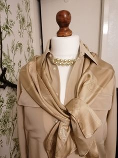 Beautiful Ralph Lauren silk scarf in soft camel/sand/beige tones. Livery print. Soft and draping with fine stitched edging. Long narrow scarf that looks beautiful with everything.  Size: Width: 12 inches Length: 52 inches Classic Gold Silk Scarf For Formal Occasions, Elegant Beige Silk Scarf For Formal Occasions, Cream Silk Scarf For Formal Occasions, Elegant Brown Silk Scarf For Formal Occasions, Classic Beige Scarf For Formal Occasions, Elegant Gold Scarves For Formal Occasions, Elegant Beige Scarf For Formal Occasions, Elegant Cream Scarf For Formal Occasions, Formal Beige Silk Scarf