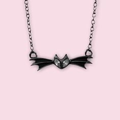 ✨Pumpkin King✨ A Nightmare before Christmas inspired Bat necklace. Is the Pumpkin King one of your Favorite Spooky Character? Show it off by adding this Bat bow tie Necklace to your collection. This Necklace is made of Sterling Silver with Gold, Rose Gold, Rhodium or, Black Rhodium Plated. It is 16in with an attached 2in extension to be 18in. Recommended Care and Cleaning: Do not wear in pool or shower. Do Not wear to sleep. Clean with polishing cloth ( Available on the web) . Wearing over time Emo Style Necklace For Halloween, Halloween Themed Black Necklace, Black Themed Necklace For Halloween, Themed Black Necklace For Halloween, Halloween Novelty Jewelry For Cosplay, Black Necklace For Halloween Cosplay, Halloween Cosplay Novelty Jewelry, Emo Halloween Party Necklaces, Adjustable Necklaces For Halloween Costume Party