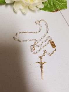 "Beautiful Vintage Rosary, new never been used in original clear box. Makes a perfect gift for Catholic Wedding couple, First Communion, Confirmation, Birthday. Dementions: Decades length: 18\" Complete folded rosary as shown laying on table including crucifix: 14\" Crucifix: 1 1/2\" x 7/8\" FINAL SALE, NO RETURNS, NO EXCHANGES, PLEASE CONTACT FOR ANY QUESTIONS OR CONCERNS AFTER LOOKING AT ALL THE PICTURES." Gold Cross Rosary For Wedding, Gold Wedding Rosary With Cross Shape, 8mm Bead Crucifix For First Communion, 8mm Bead Crucifix Jewelry For First Communion, Gold Rosary With Round Beads As Gift, Gold Round Beads Rosary As Gift, Wedding Rosary With Crucifix Spiritual Style, Spiritual Wedding Rosary With Crucifix, Adjustable Rosary With Miraculous Medal Gift