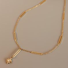 ✦ Dazzle with celestial charm in our Star Pendant Chain Necklace, luxuriously plated in 18K gold. Crafted to captivate, this necklace features a timeless star pendant suspended from a delicate chain. Elevate your ensemble with celestial elegance, whether worn alone for understated sophistication or layered for a trendsetting statement.----------- DETAILS ----------- - Color: Gold - Pattern: Star Pendant/ Ball Pendant - Chain Length: 45cm - Materials: 18K Gold Plated, 316L Surgical Steel, Cubic Z Elegant Gold Plated Charm Necklaces With Star Charm, Elegant Gold Plated Charm Necklace With Star, Elegant Star-shaped Chain Necklace With Star Charm, Elegant Gold Chain Necklace With Star Charm, Elegant Star Charm Necklace, Tarnish Resistant, Elegant Star-shaped Tarnish Resistant Charm Necklace, Celestial Gold Plated Necklace With Star Charm, Half Chain Necklace, Pendant Ball