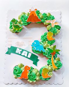 the letter k is made out of cupcakes and decorated with green icing