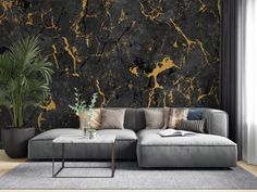 a modern living room with black and gold paint on the walls, couches and rugs