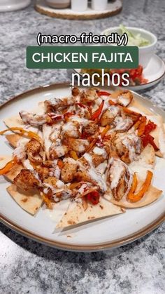 chicken fajita nachos on a white plate