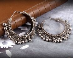 Gungroo adorned Silver Hoop earrings- tinkle your way through the crowd. These beautiful earrings are handcrafted in metal alloy and oxidized silver. It is a perfect match for traditional kurtas and will go with all your casual and formal ethnic attire. Occasion: Will add luster when worn for a wedding, engagement, party, prom and any special occasion. It will enhance special days like Valentine's Day, Birthdays, Anniversaries, and Mother's Day. Ideal Gift Idea: Perfect beautiful & memorable Trendy Jhumkas, Afghani Earrings, Silver Hoops Earrings, Oxidised Jewelry, Jaipur Jewelry, Pakistani Earrings, Color Knowledge, Oxidized Earrings, Silver Jewelry Accessories