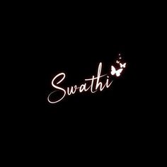 the word surati is lit up in the dark with butterflies flying around it