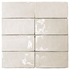 six square white ceramic tiles on a white background