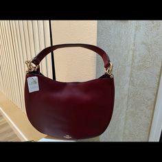 Brand New Large Leather Hobo Ready For Immediate Pick Up, (2) Available Sold Separately Elegant Burgundy Leather Hobo Bag, Elegant Coach Hobo Bag In Soft Leather, Elegant Coach Soft Leather Hobo Bag, Elegant Coach Hobo Bag With Leather Handles, Elegant Coach Hobo Bag With Detachable Handle, Elegant Burgundy Hobo Bag With Removable Pouch, Elegant Coach Hobo Bag With Gold-tone Hardware, Elegant Coach Hobo Bag For Formal Occasions, Elegant Burgundy Hobo Bag For Shopping