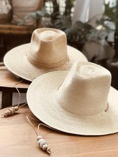 Adjustable Natural Sun Hat With Flat Crown, Adjustable Natural Color Fedora With Flat Crown, Adjustable Beige Straw Hat With Flat Crown, Natural Fedora With Adjustable Flat Crown, Adjustable Natural Fedora With Flat Crown, Adjustable Cream Panama Hat For Ranch, Rustic Natural Panama Hat With Short Brim, Natural Toquilla Straw Hat Bands For Festivals, Artisan Adjustable Panama Hat In Palm Leaf