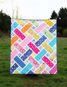 the tesa quilt pattern is shown in multi - colored squares and has been made by valor wells