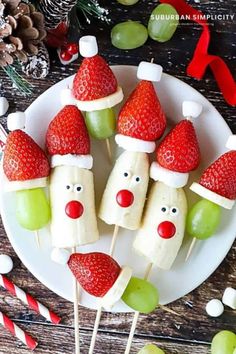 some fruit with santa hats on them and candy canes in the shape of faces