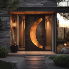 an entrance to a modern home at night