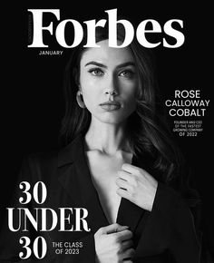 a magazine cover with a woman wearing a black suit