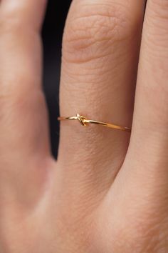 This stacking Knot ring is really cute and easy to wear! The closed wire knot adds a bit of extra detail to this otherwise simple hammered stacking ring. This is one single length of 14K Gold Fill metal that is knotted into a tight, closed knot and soldered around the back. This ring is a great alternative to a gold st Tiny Gold Rings Minimalist Jewelry, Slim Gold Ring, Simple And Elegant Rings, Gold Ring Ideas For Women, Gold Ring Minimalist, Simple Yellow Gold Jewelry, Gold Rings Dainty, Gold Minimalist Rings, Women’s Rings