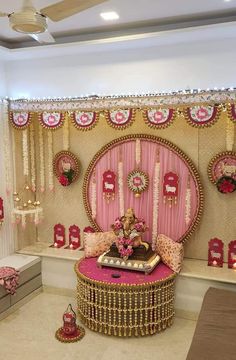 a living room decorated in pink and gold