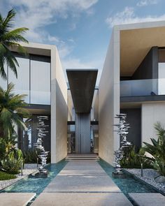 an entrance to a modern home surrounded by palm trees