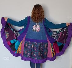 "Purple patchwork jacket, Upcycled denim coat, Plus size clothing, Bohemian duster coat, Patchwork denim coat, Plus size bohemian jacket,  One of a kind plus size upcycled denim coat. The patchwork jacket is made from a blue denim jacket, green fleece ( sleeves) and odd thin and thick cotton fabrics. There are 2 pockets at the front. Boho bohemian clothing. Unique boho duster, impossible to copy  Size  2xl - 3XL  Measurements : bust - 54\" and slightly stretches length - 40\" Please follow me on facebook to be up-to-date with my new designs  https://www.facebook.com/BosaHandmade-Clothing-110481180427764 There is a lot of outstanding designs in different sizes in my shop www.etsy.com/uk/shop/BosaHandmade?ref=hdr_shop_menu Shipping - within 2-3 working days after receiving payment . All cust Boho Duster, Upcycling Jeans, Upcycled Denim Jacket, Plus Size Bohemian, Bohemian Jackets, Coat Plus Size, Bohemian Clothing, Patchwork Denim, Patchwork Jacket