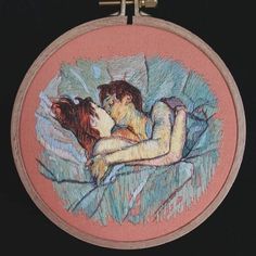 an embroidered picture of a woman laying on a bed with her arm around a man's head