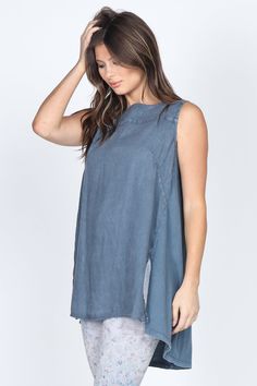 Made with the finest quality fabrics, dyed and handled in small-batch production, our novelty wash styles are the high-quality and unique styles you need in your collection!This super classy sleeveless tunic top will elevate any outfit, especially with our coordinating linen bottoms!Featuring a boat neckline, a pleated back, and side slits! Blue Washed Tank Top For Spring, Spring Sleeveless Tunic, Blue Pre-washed Tops For Spring, Spring Acid Wash Tops, Chic Blue Washed Tops, Indigo Sleeveless Top For Spring, Sleeveless Washed Blue Top For Spring, Sleeveless Washed Tops For Spring, Sleeveless Indigo Tops For Spring