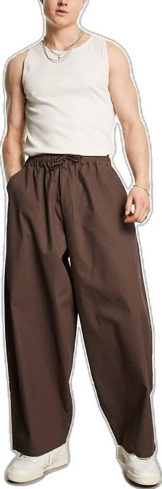 Baggy Brown Bottoms With Side Pockets, Brown Baggy Bottoms With Side Pockets, Baggy Brown Wide-leg Cargo Pants, Baggy Brown Bottoms With Elastic Waistband, Baggy Brown Tapered Leg Bottoms, Baggy Brown Bottoms With Tapered Leg, Brown Baggy Tapered Leg Bottoms, Brown Wide Leg Parachute Pants With Side Pockets, Loosely Fitted Brown Bottoms With Elastic Waistband