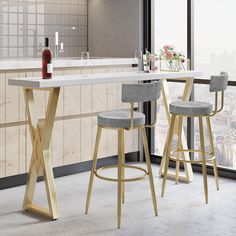 two bar stools in front of a kitchen counter