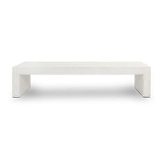 a white coffee table sitting on top of a white floor