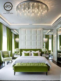 a bedroom decorated in green and white with chandelier above the bed, two chairs at the foot of the bed