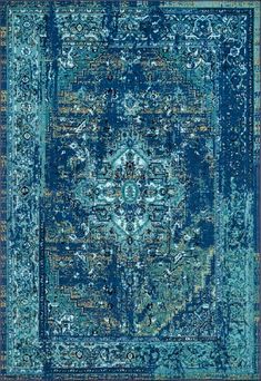 a blue rug with an ornate design on the top and bottom, in different colors