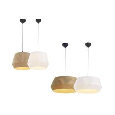 three lamps hanging from the ceiling in different shapes and sizes, one light on each side