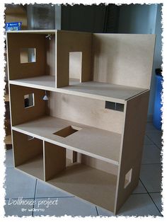 a cardboard doll house built into the floor