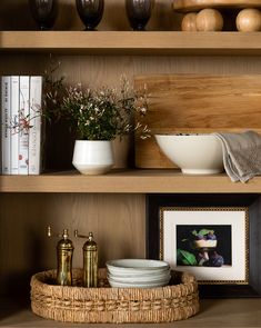 shelves with bowls, plates and vases on them