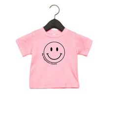 Smiley Face Kids Tee 100% Cotton Playful Black T-shirt For Spring, Playful Black Cotton Shirt, Funny Print Tops For Spring Playtime, Funny Print T-shirt For Spring Playtime, Funny Graphic Print Tops For Playtime, Funny Short Sleeve Tops For Playtime, Casual Screen Print Tops For Playtime, Unisex Casual T-shirt For Playtime, Casual T-shirt With Funny Print For Playtime