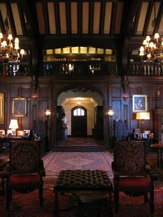 an ornately decorated room with chandeliers and chairs