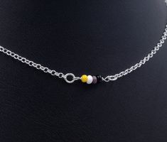 "Handmade sterling silver necklace. Dainty acrylic beads making up the nonbinary pride flag. Delicate silver chain. Order at least 2.5 cm (1\") longer than the intended wearers neck for a tight fit. Longer for a looser fit. Matching bracelet: https://www.etsy.com/listing/1023652477 Necklace and bracelet set (lower price): https://www.etsy.com/listing/1009678292 This is is a made to order listing and you'll get a necklace like the one in the pictures, not the exact copy in the pictures. Please co Silver Beads Choker Jewelry Gift, Silver Beaded Chain Choker As A Gift, Multicolor Necklaces With Silver Chain As Gift, Multicolor Necklaces With Silver Chain For Gifts, Multicolor Necklace With Silver Chain As Gift, Silver Spacer Beads Choker For Gift, Silver Chain Beaded Necklaces With Round Beads As Gift, Multicolor Sterling Silver Beaded Necklaces For Gifts, Gift Beaded Necklaces With Silver Chain And Round Beads