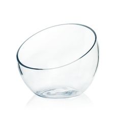 a clear glass bowl sitting on top of a white table