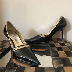 Black Patent Shoe With Gold Metallic Cut Out Detail And A Chic Pointed Toe. Shoe Conversion For This Designer Is Equivalent To Us Size 6 Approximate Heel Height 3" Made In Italy Condition: Good. Light Wear Reflected With A Few Marks. Black Patent Shoes, Patent Shoes, Patent Leather Heels, Leather Heels, Shoes Women Heels, Patent Leather, Gold Metal, Heel Height, Shoes Heels