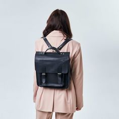 Looking for a versatile backpack that's stylish and functional? Look no further than our handmade leather backpack for women. With its spacious interior and comfortable straps, this backpack is perfect for everything from commuting to work to exploring new cities. Made from high-quality leather, it's built to last and elevate your style. Highlights: - Handmade with care and attention to detail  - Made from premium leather for durability and style  - Backpack design allows for hands-free use  - Spacious interior with multiple compartments for organization  - Adjustable straps for a custom fit  - Can accommodate laptops  Benefits: - Fashionable and functional for everyday use  - High-quality leather that ages beautifully over time  - Versatile design makes it perfect for work, travel, and le Luxury Timeless Satchel Briefcase, Luxury Satchel Backpack For Adventure, Modern Leather Satchel Backpack, Luxury Functional Satchel Briefcase, Luxury Professional Briefcase For Daily Use, Luxury Black Versatile Briefcase, Luxury Office Briefcase Satchel, Luxury Black Business Backpack, Luxury Black Modern Briefcase