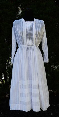 Antique 1910's cotton lady Edwardian dress color ecru, In good antique condition, Few holes on it. Few light stain, The pictures is part description, Sold as is. It's 100 % cotton. Weighs 6.6 Oz. Thanks. Shoulder 15" Bust: 32 Waist: 28" Chest/bust 36" long Sleeves  16"1/2 Length 43" long Vintage White Dress For Daywear, Long Sleeve Dresses With Historical Design For Daywear, White Victorian Dress For Vintage Fashion, White Vintage Dress With Historical Design, Victorian Style Vintage Dress For Daywear, White Victorian Dress For Daywear, Vintage Broderie Anglaise Dress For Daywear, Victorian Broderie Anglaise Dresses For Daywear, Historical Design Long Sleeve Dress For Daywear