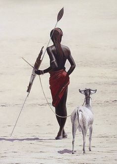 a person with a stick and a goat on the beach