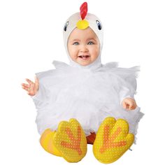 a baby in a chicken costume sitting on the floor with her hands out and smiling