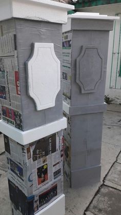 two cement pedestals sitting next to each other