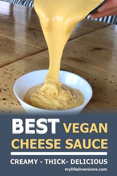 the best vegan cheese sauce is in a white bowl and being poured into it